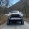 customer tacoma with TRD pro style grille photo customer tacoma with TRD pro style grille on dirt road in the mountains