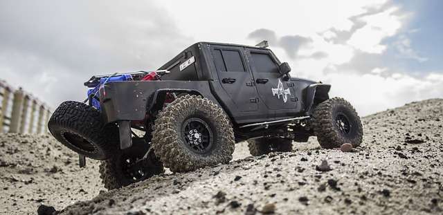 black jeep gladiator offroad in the sand