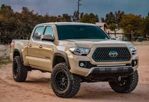 3rd gen tacoma mod with light bar on front of brown tacoma