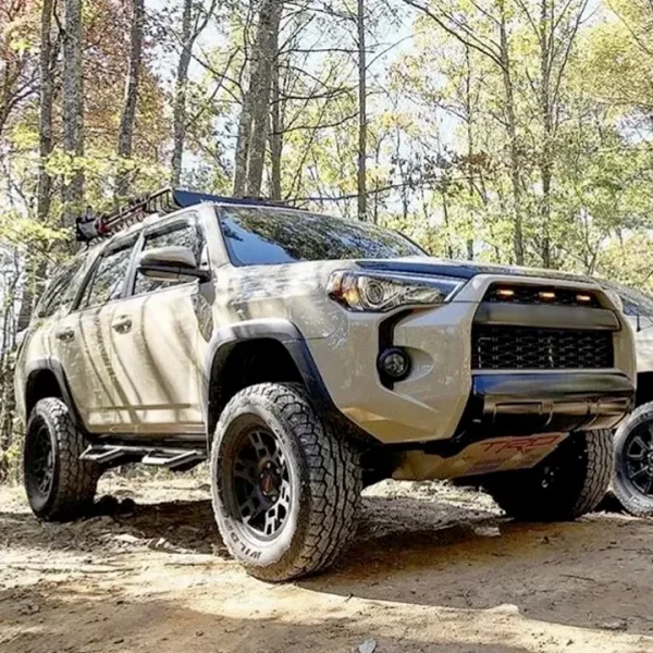 4Runner TRD pro grill installed on brown 4Runner in a wooded setting