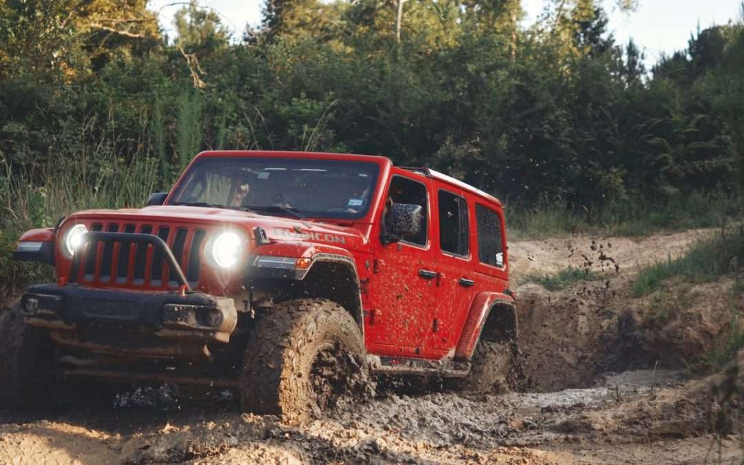 image of Red Jeep Wrangler Offroading